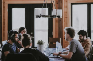 A team of employees sitting around a conference table.