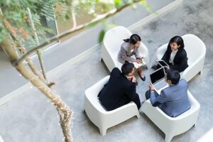 business people sitting in chairs meeting